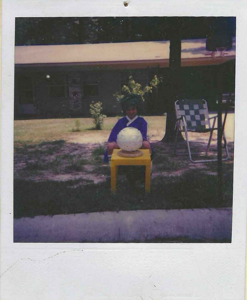 Photo of Scott as a fortune teller with a soccer ball wrapped in aluminum foil.